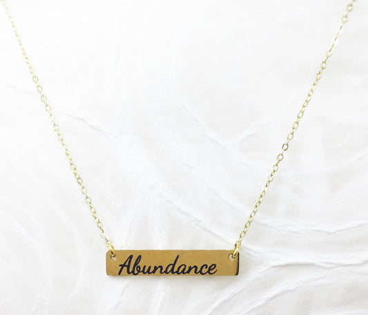 Power of Words: Engraved Goldtone Stainless Steel Necklace (horizontal)